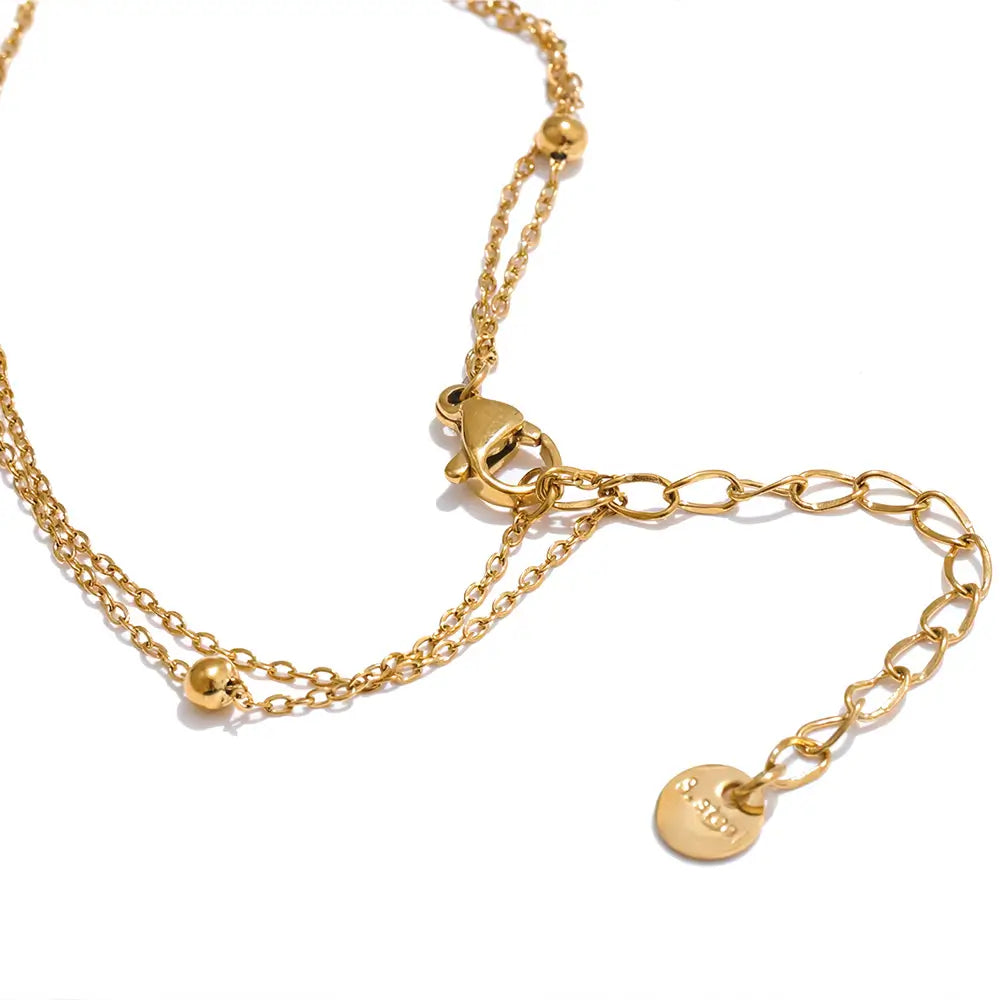Colar Feminino Dourado duplo ponto de luz com zircônia, lapidação precisa e acabamento reluzente isolado, fecho