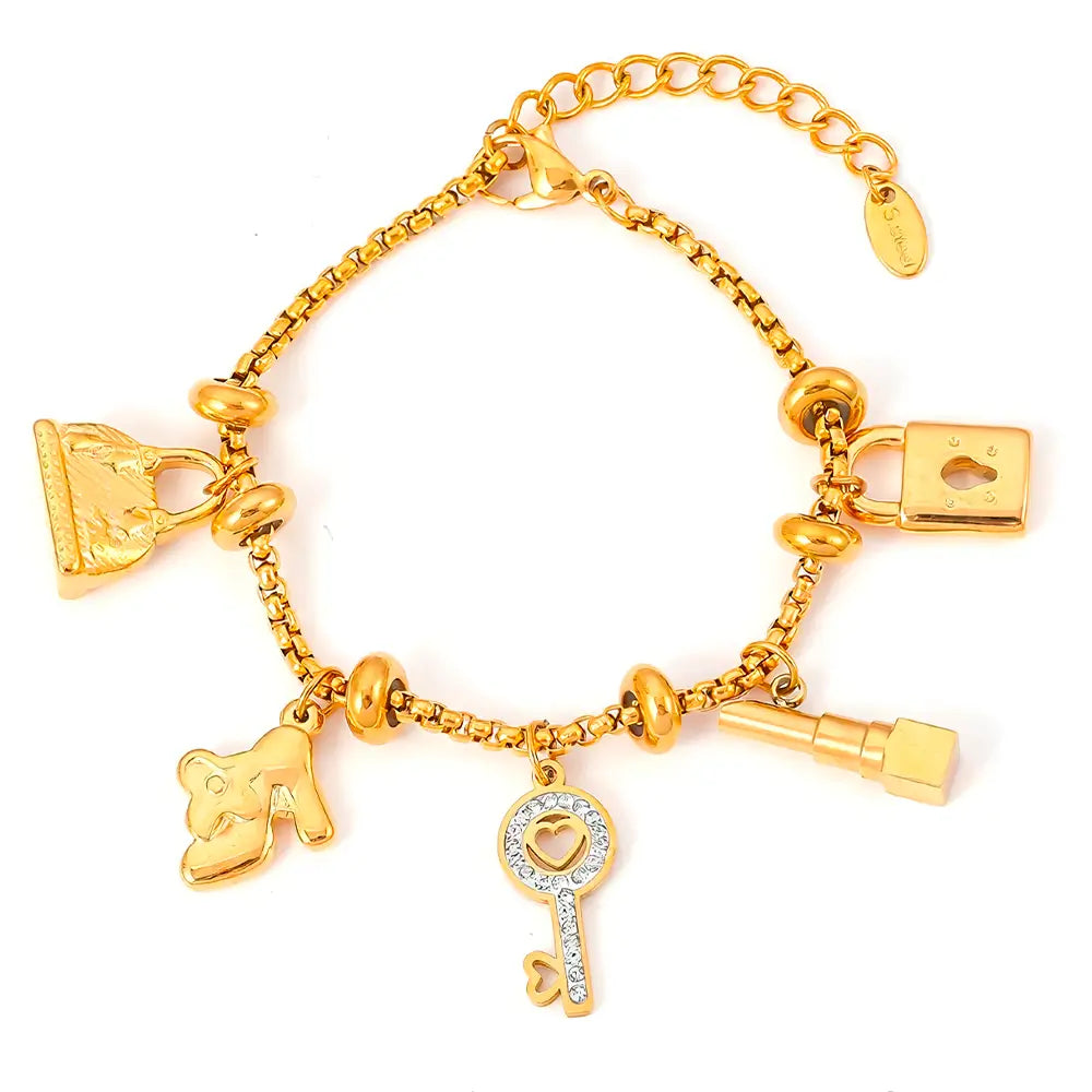 Pulseira Berloques em Aço Inox Dourada Feminina de Cadeado, Bolsa, Batom e Chave Luxelle - Banhada a Ouro 18k, fundo branco