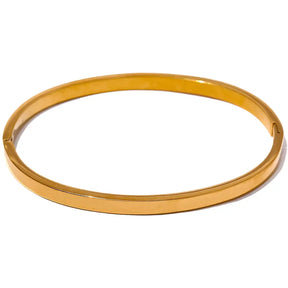 Bracelete Dourado Feminino rígido minimalista Eloah com acabamento espelhado em fundo branco
