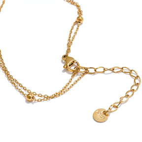 Colar Feminino Dourado duplo ponto de luz com zircônia, lapidação precisa e acabamento reluzente isolado, fecho