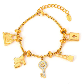 Pulseira Berloques em Aço Inox Dourada Feminina de Cadeado, Bolsa, Batom e Chave Luxelle - Banhada a Ouro 18k, fundo branco